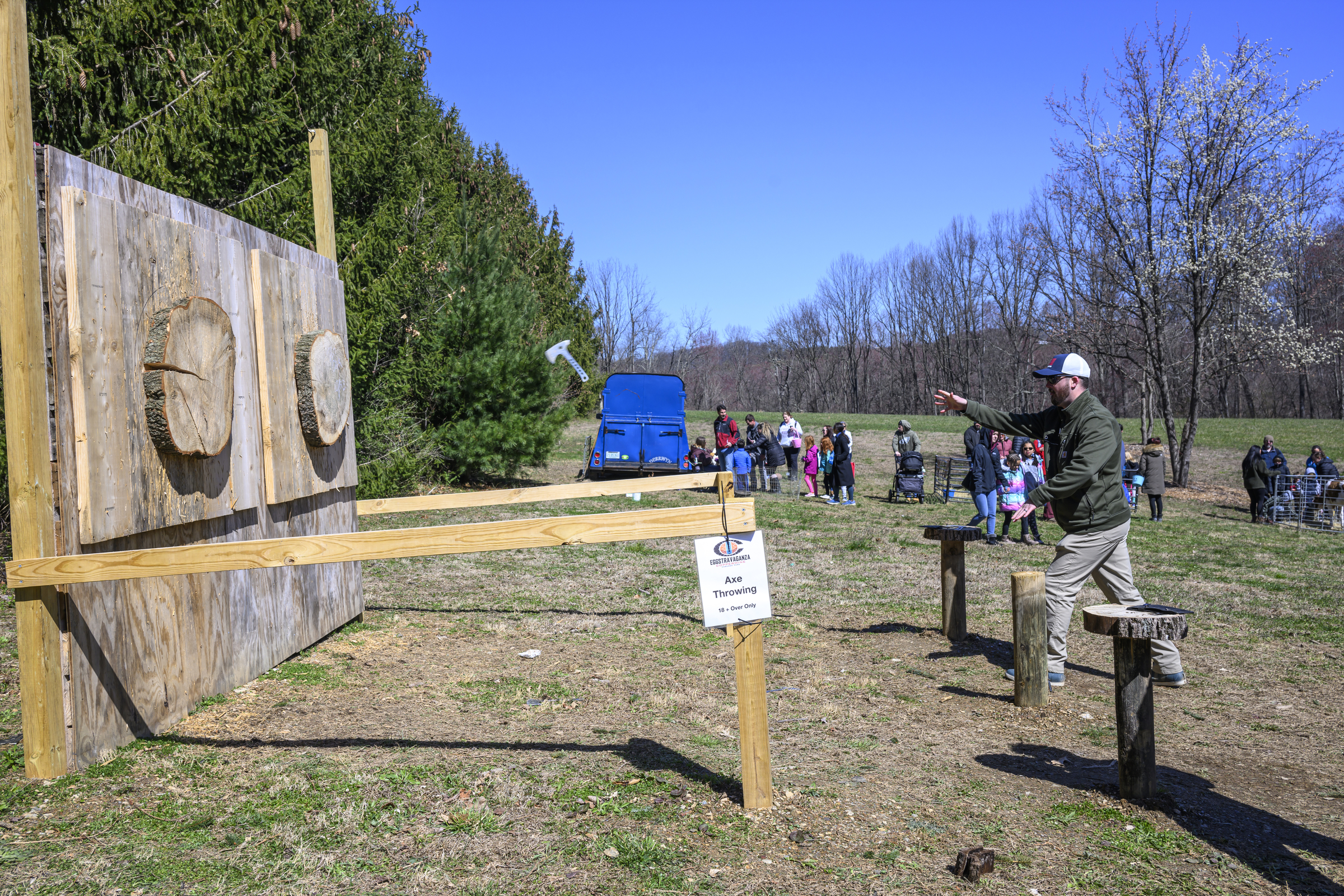 Gunner Cullison gives axe throwing a try during the Coppermine Eggstravaganza at Cascade Park in Hampstead. (Thomas Walker/Freelance)