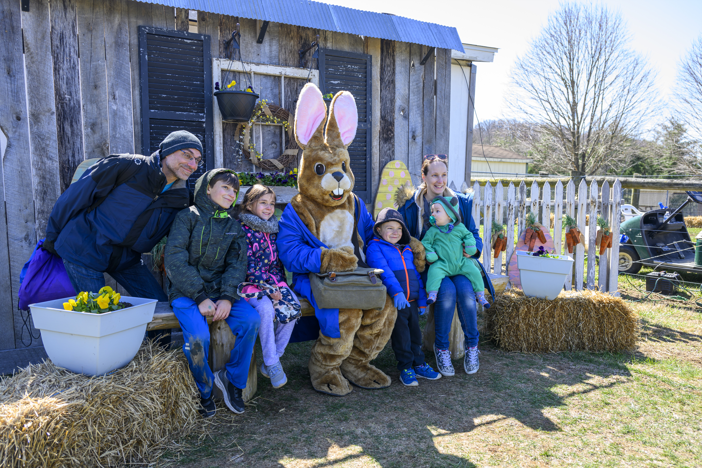 A family poses with the Easter Bunny during the Coppermine Eggstravaganza at Cascade Park in Hampstead. (Thomas Walker/Freelance)