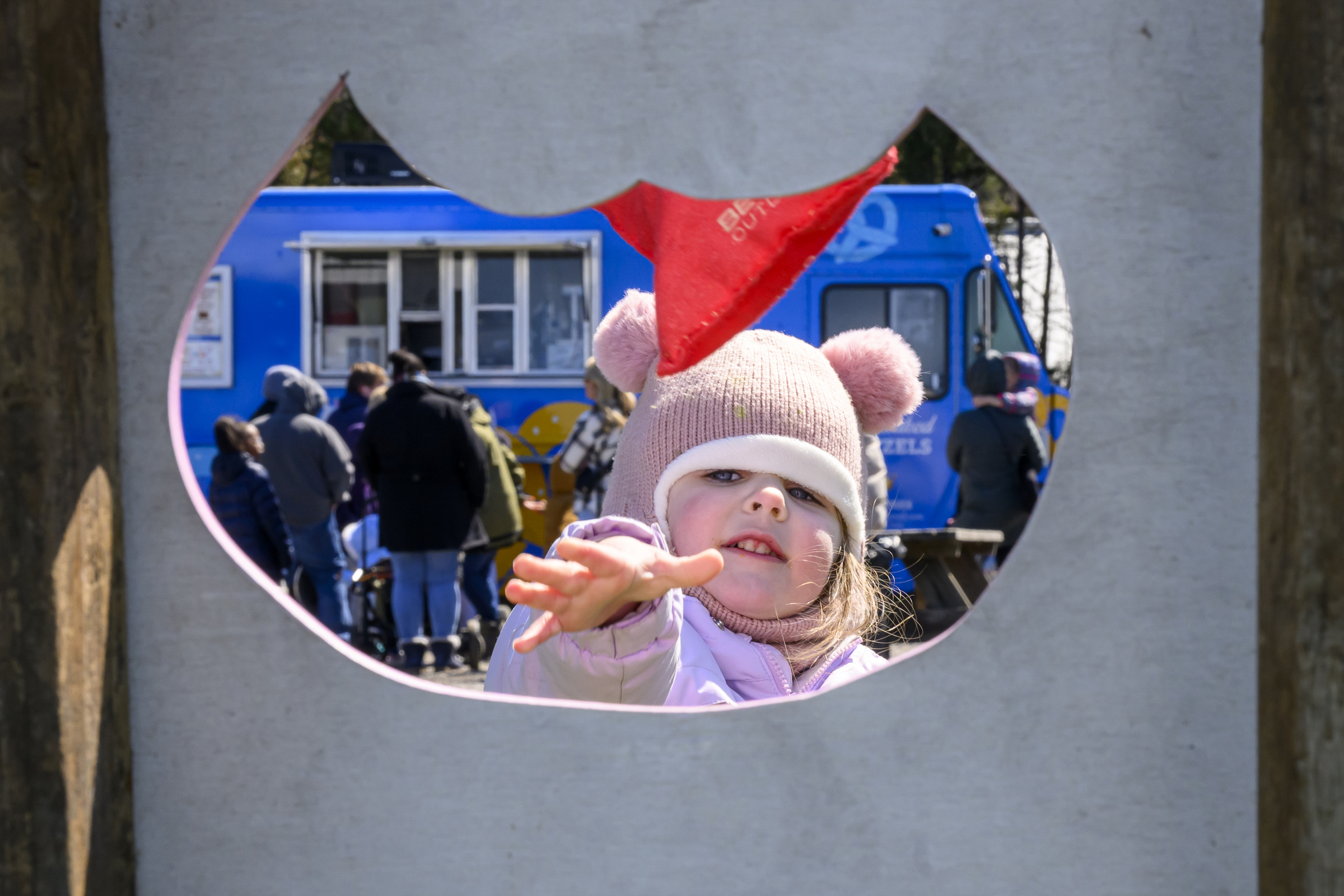 Emma Riling, 3, tosses a bean bag toward a cutout during the Coppermine Eggstravaganza at Cascade Park in Hampstead. (Thomas Walker/Freelance)