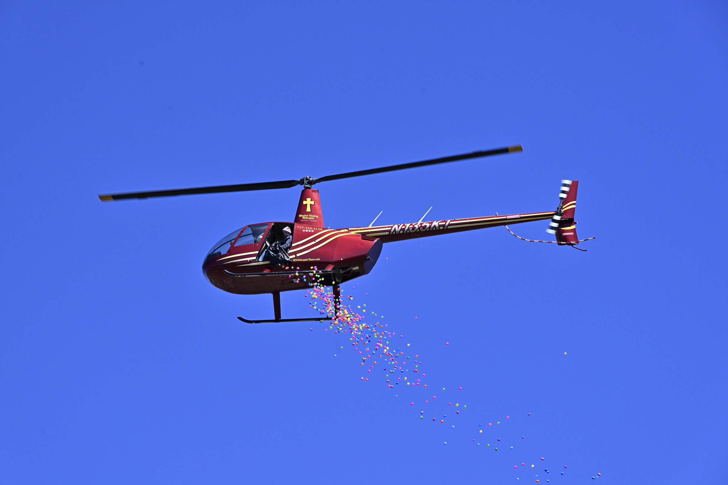 Plastic Eggs drop from a helicopter during the Coppermine Eggstravaganza at Cascade Park in Hampstead. (Thomas Walker/Freelance)