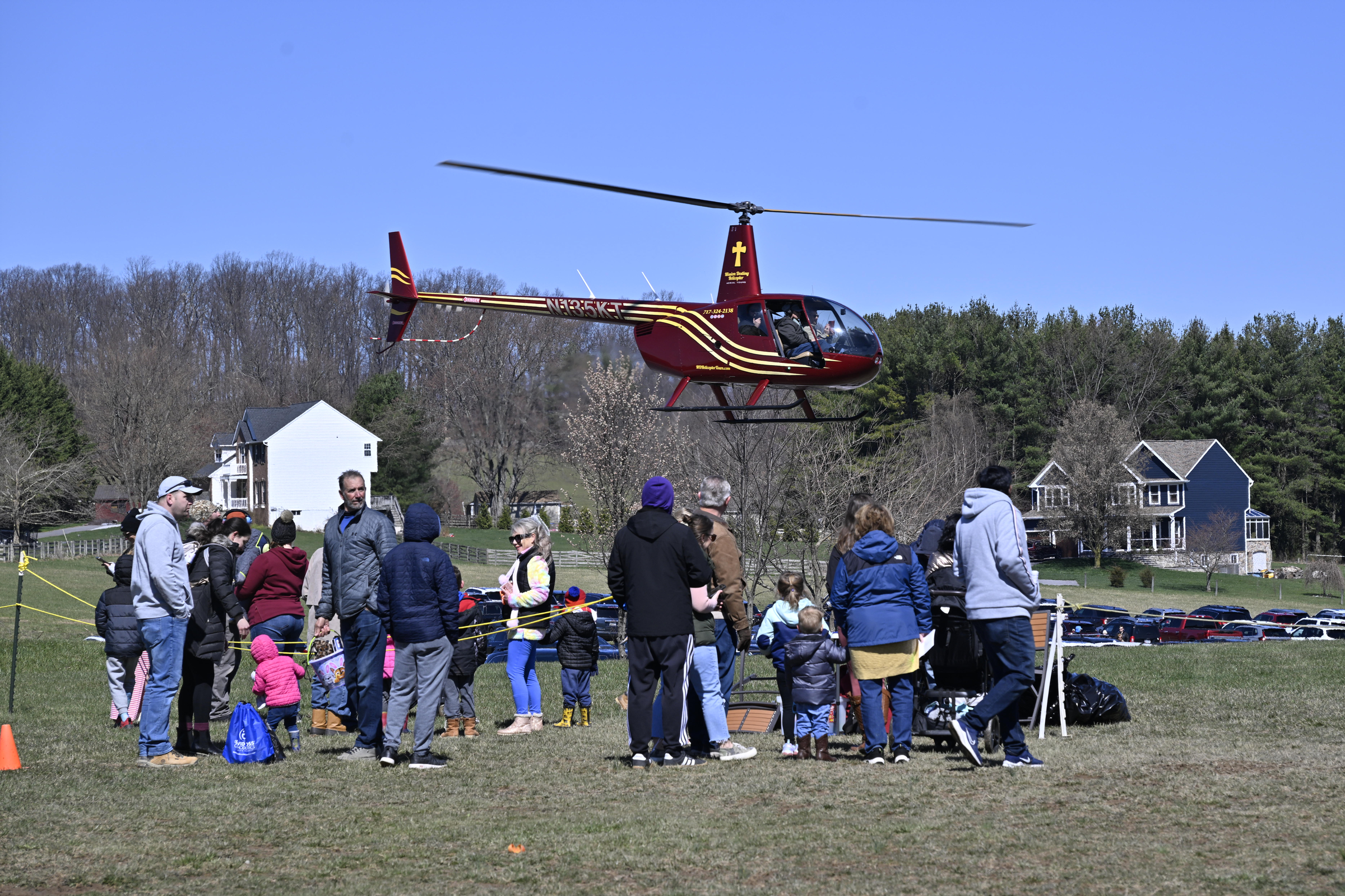 People wait in line for a helicopter ride during the Coppermine Eggstravaganza at Cascade Park in Hampstead. (Thomas Walker/Freelance)