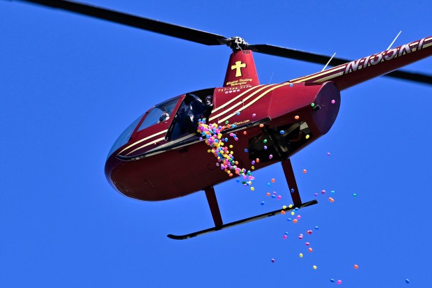 Easter eggs, not turkeys, are dropped from a helicopter during the Coppermine Eggstravaganza at Cascade Park in Hampstead. (Thomas Walker/Freelance)