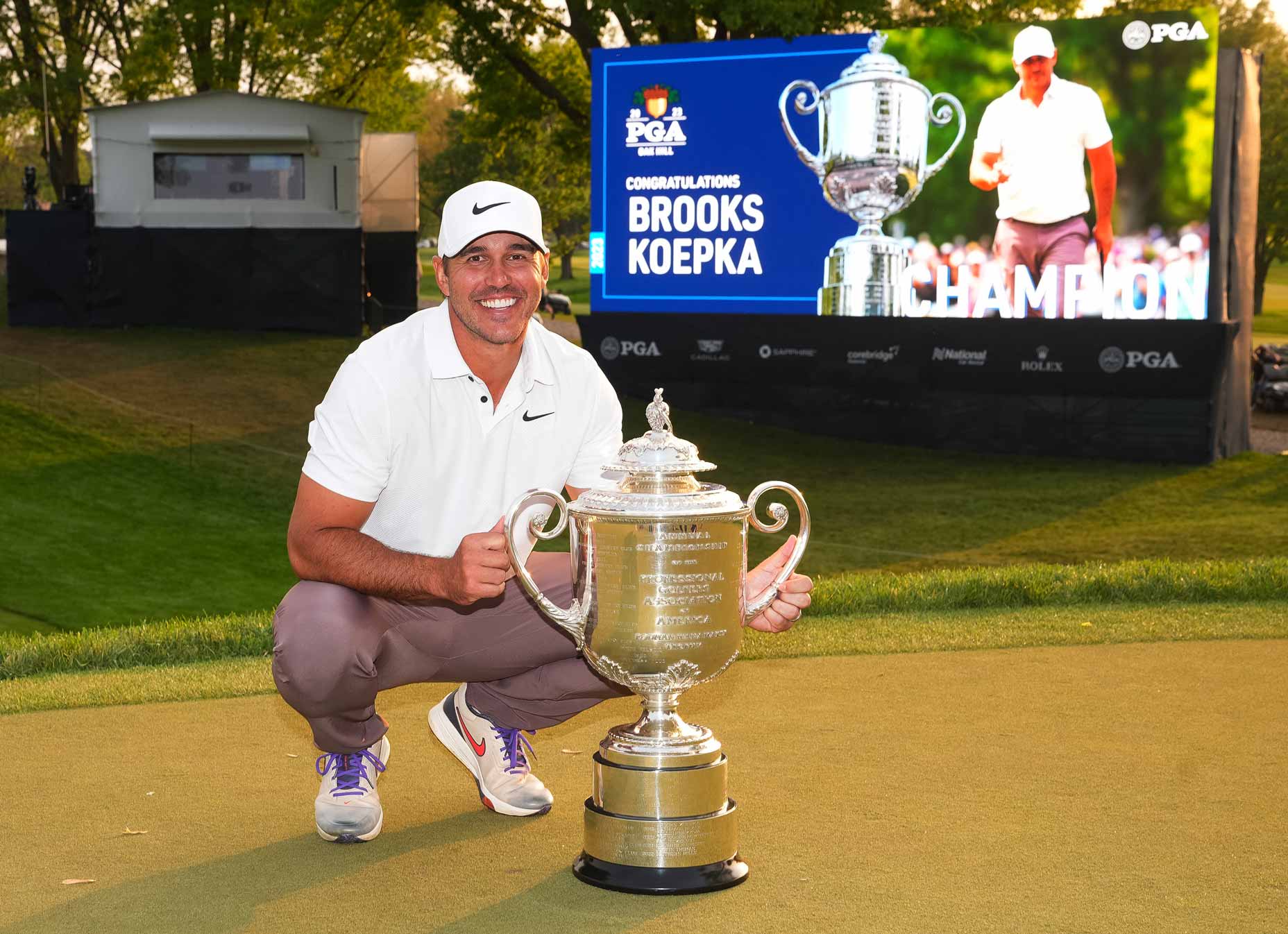 Brooks Koepka smiles with The Wanamaker Trophy after his victory in the final round of the PGA Championship at Oak Hill Country Club on Sunday, May 21, 2023 in Rochester, New York.