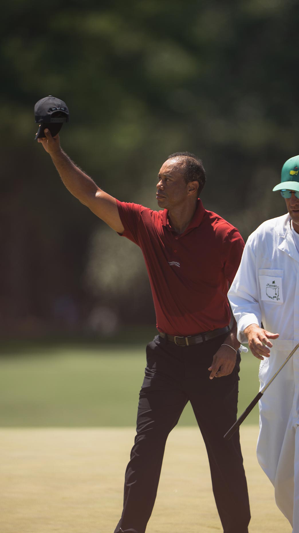 Tiger Woods waves to crowd on Masters Sunday at Augusta National.