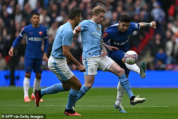 Chelsea's Argentinian midfielder #08 Enzo Fernandez (R) vies with Manchester City's Belgian midfielder #17 Kevin De Bruyne (2R) during the English FA Cup semi-final football match between Manchester City and Chelsea at Wembley Stadium in north west London on April 20, 2024. (Photo by Ben Stansall / AFP) / NOT FOR MARKETING OR ADVERTISING USE / RESTRICTED TO EDITORIAL USE (Photo by BEN STANSALL/AFP via Getty Images)