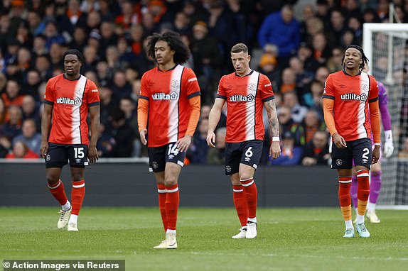 Soccer Football - Premier League -  Luton Town v Brentford - Kenilworth Road, Luton, Britain - April 20, 2024  Luton Town's Ross Barkley, Tahith Chong, Teden Mengi and Gabriel Osho react after Brentford's Yoane Wissa scores their first goal Action Images via Reuters/Peter Cziborra NO USE WITH UNAUTHORIZED AUDIO, VIDEO, DATA, FIXTURE LISTS, CLUB/LEAGUE LOGOS OR 'LIVE' SERVICES. ONLINE IN-MATCH USE LIMITED TO 45 IMAGES, NO VIDEO EMULATION. NO USE IN BETTING, GAMES OR SINGLE CLUB/LEAGUE/PLAYER PUBLICATIONS.