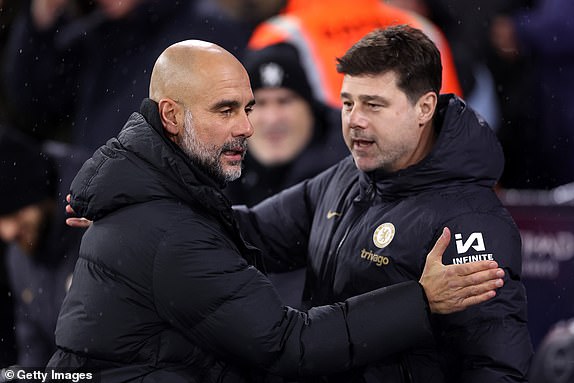 MANCHESTER, ENGLAND - FEBRUARY 17:  Pep Guardiola, Manager of Manchester City, and Mauricio Pochettino, Manager of Chelsea, interact prior to the Premier League match between Manchester City and Chelsea FC at Etihad Stadium on February 17, 2024 in Manchester, England. (Photo by Catherine Ivill/Getty Images)