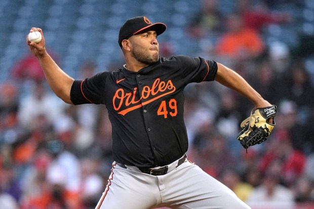 Baltimore Orioles pitcher Albert Suárez throws to the plate during...