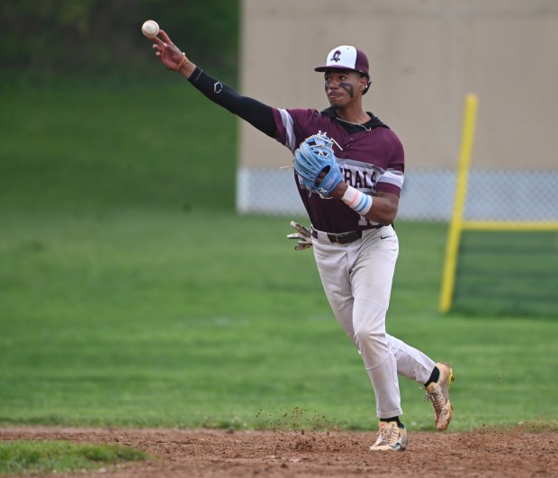 Towson shortstop Aziz Bishop throws to first to force out a Hereford runner during a baseball game at Towson High School on Friday. (Brian Krista/staff photo)