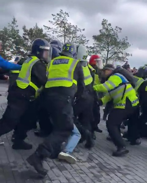 Police in riot gear clashed with fans outside Tottenham's stadium