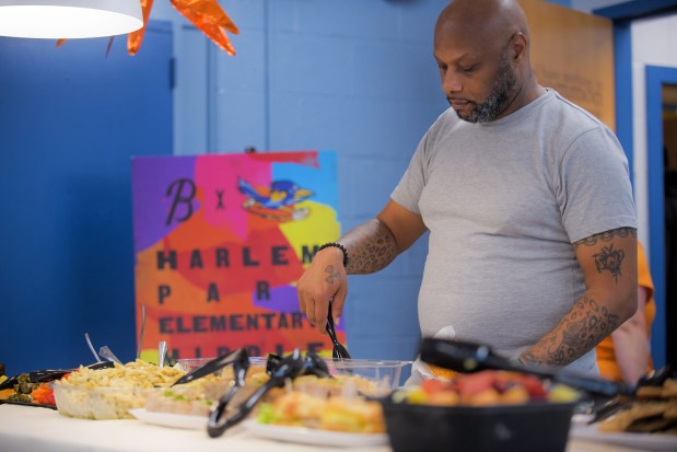 Tavon Pope, social studies lead at Harlem Park Elementary Middle School in West Baltimore, gets lunch during Teacher Appreciation Day in which the Baltimore Orioles continue their Adopt-A-School campaign.