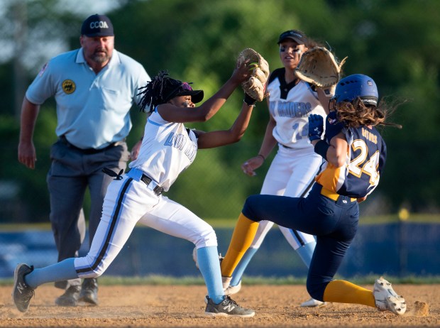Perry Hall’s Madison Carl slides into second for a stolen...