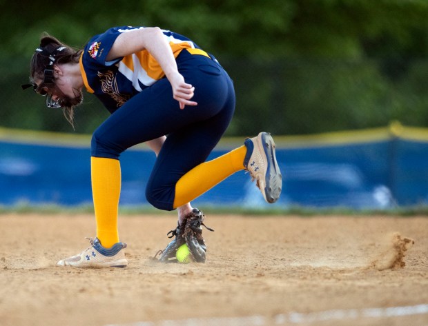 Perry Hall first baseman Rileigh Kitchen snags a grounder before...