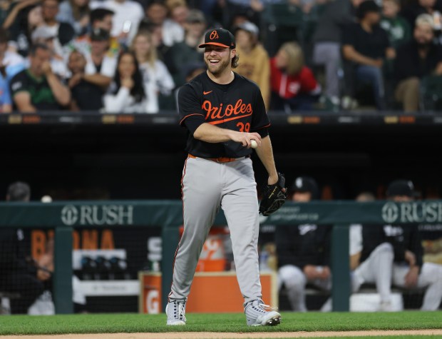 Orioles pitcher Corbin Burnes laughs between pitches in the second...