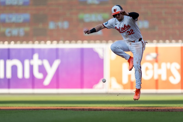 Baltimore Orioles' Ryan O'Hearn avoids a ball while advancing to...