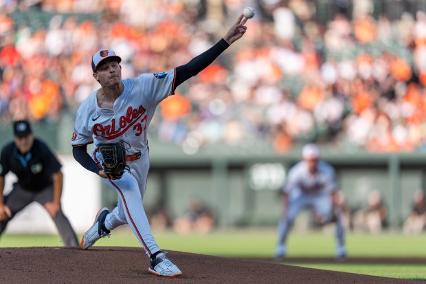 Baltimore Orioles starting pitcher Cade Povich (37) delivers during the...