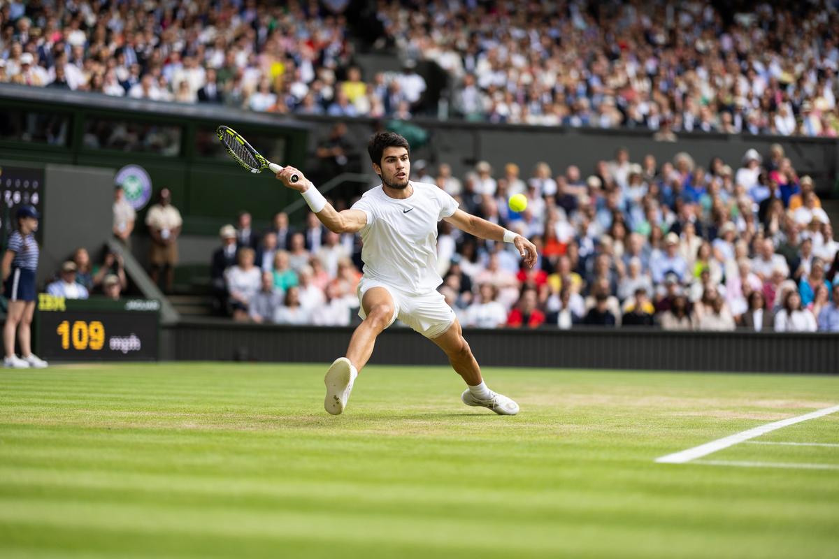 Finding a neutraliser: The likes of Carlos Alcaraz have devised a way to stretch and slide on grass, extending rallies and reducing the advantage of first-strike tennis. | Photo credit: Getty Images