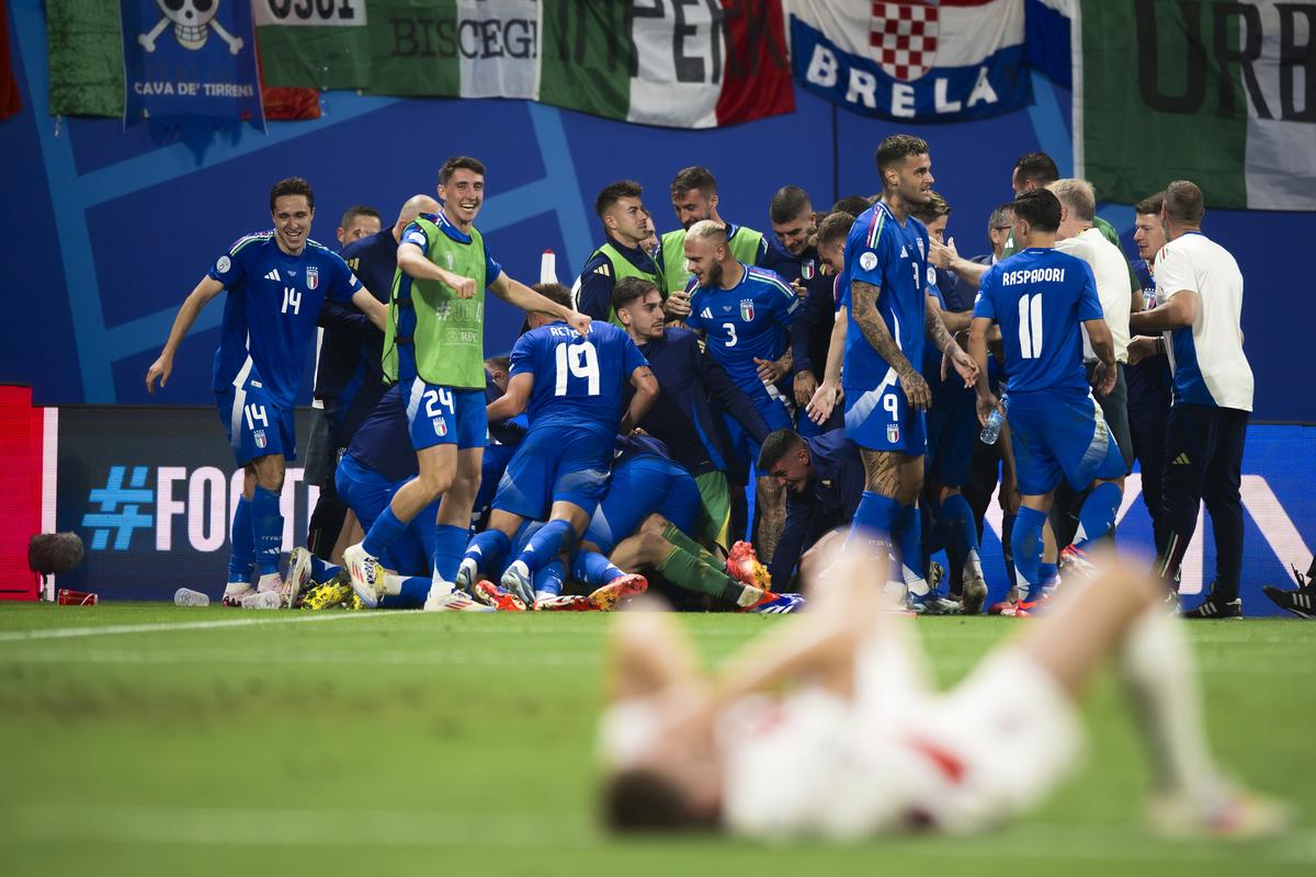 Mattia Zaccagni (C) of Italy celebrates with teammates after scoring a goal during the UEFA EURO 2024 group stage football match between Croatia and Italy. The match ended 1-1 tie. 