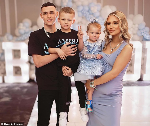 Foden and his girlfriend Rebecca Cooke announced they are expecting their third child back in April - pictured with son Ronnie, five, and daughter True, 12 months