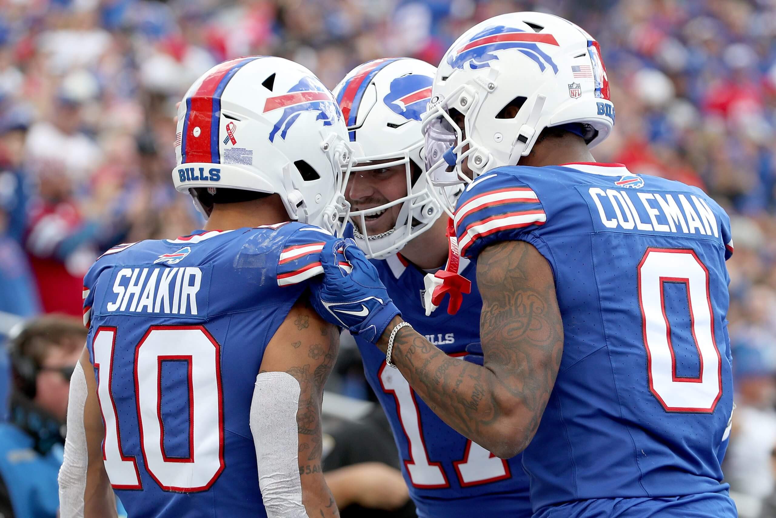 Khalil Shakir, Josh Allen, and Keon Coleman of the Buffalo Bills celebrate during the third quarter against the Arizona Cardinals at Highmark Stadium on September 08, 2024 in Orchard Park, New York.