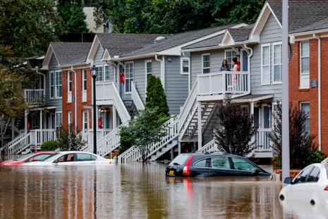 Residents stranded by floodwater await rescue in a suburb of Atlanta, Georgia, on Friday.