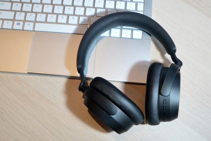 Sennheiser Accentum Wireless headphones sitting on laptop keyboard.