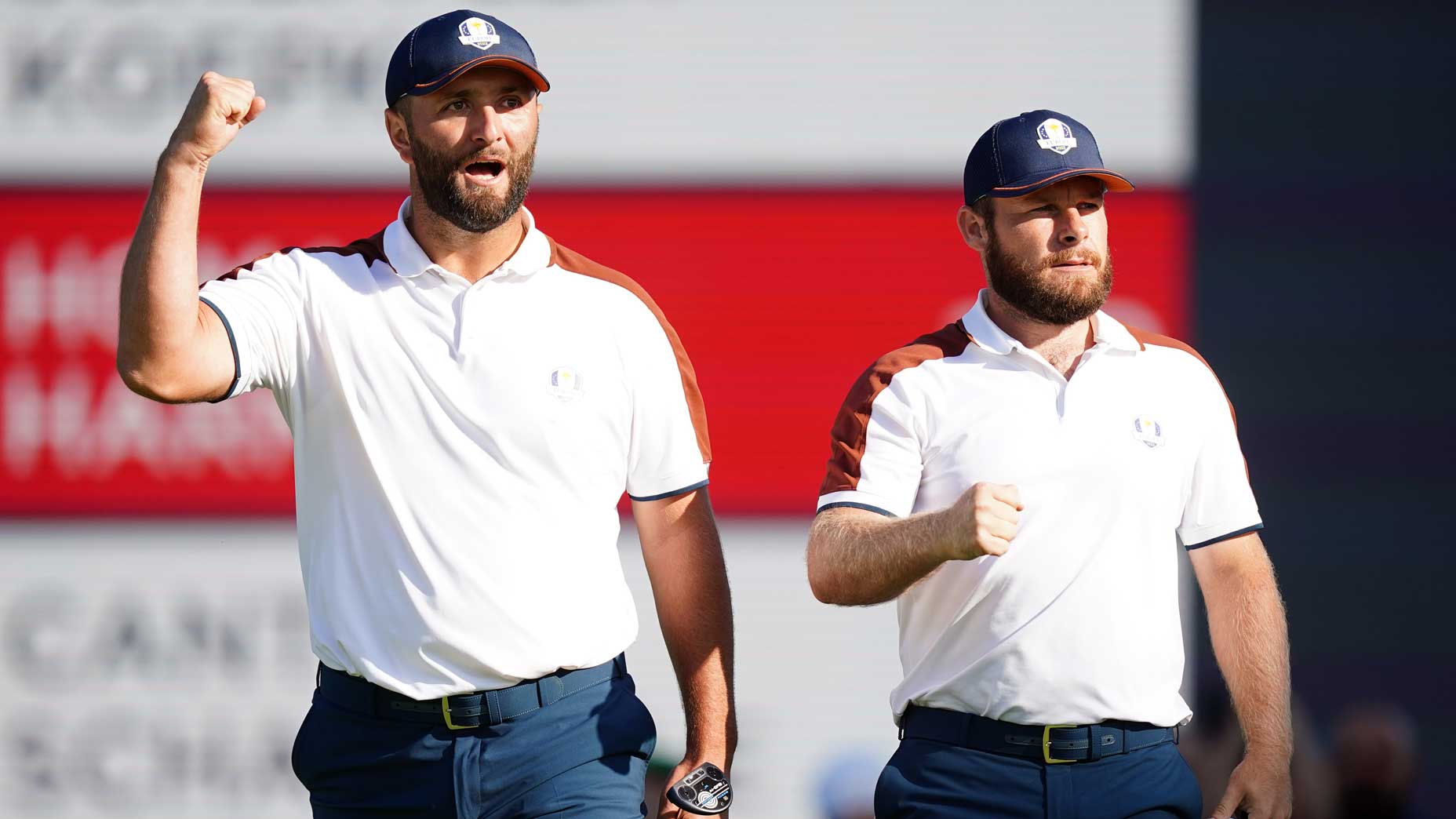 Pro golfers Jon Rahm and Tyrrell Hatton react on the 6th during the foursomes on day two of the 2023 Ryder Cup at the Marco Simone Golf and Country Club.