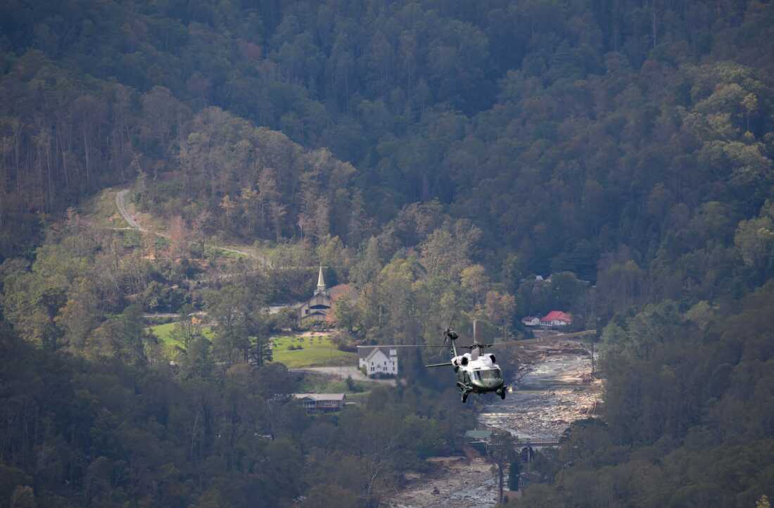 President Biden surveyed storm damage on Marine One near Asheville, N.C. on Oct. 2, 2024. The death toll from powerful storm Helene, which battered the southeastern United States, has climbed to at least 155, authorities said on October 1. (Photo by Mandel NGAN / AFP) (Photo by MANDEL NGAN/AFP via Getty Images)