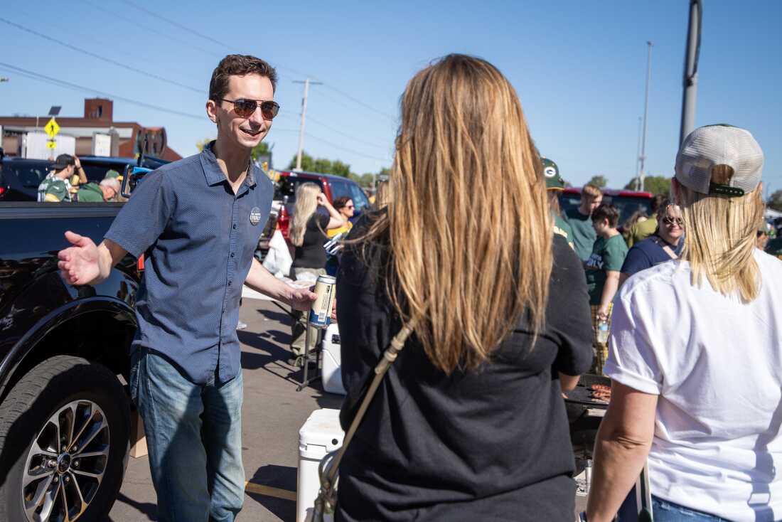 Wisconsin Assembly Candidate Ryan Spaude mingles with voters and other Democrats at a tailgate Sunday, Sept. 29, outside of Lambeau Field.