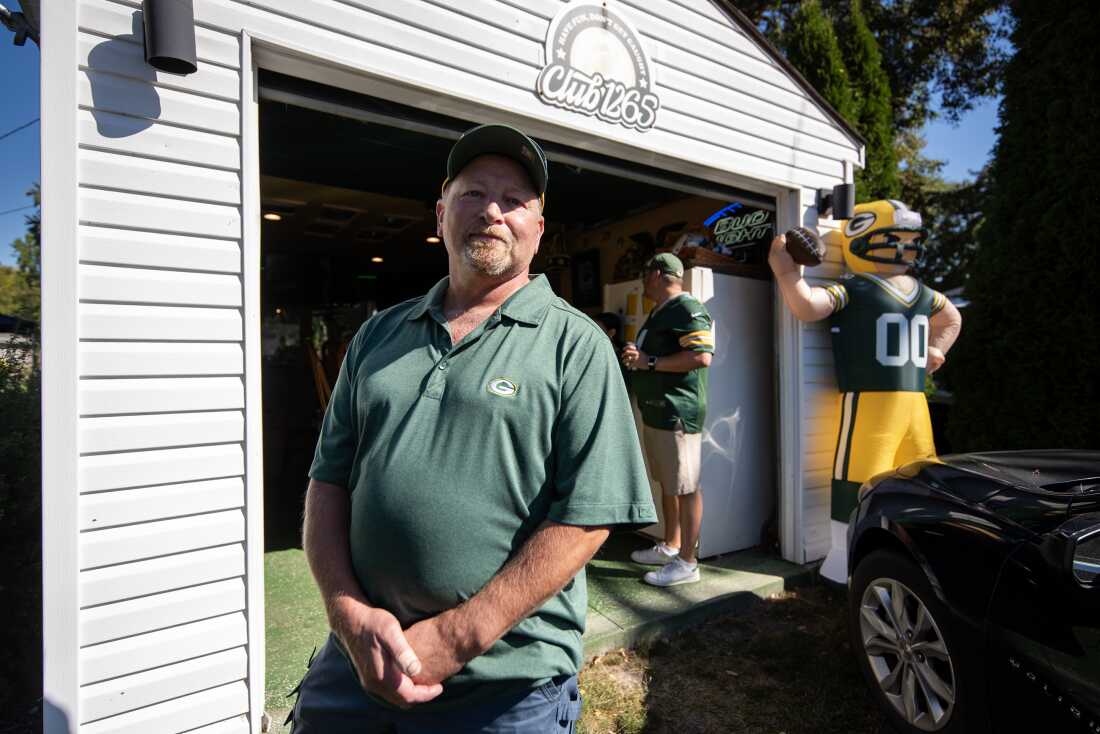 Green Bay Packers fan Bud Hearley stands outside a garage turned into a bar in a neighborhood near Lambeau Field on Sunday, Sept. 29, before the Packers’ game against the Minnesota Vikings.