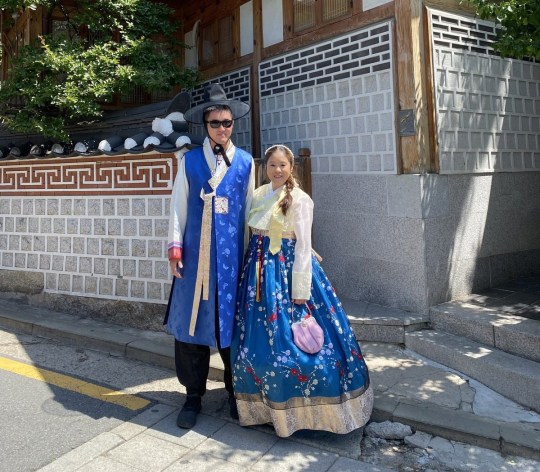 Linda, right, in traditional Asian clothing for cosplay, with a friend on the left