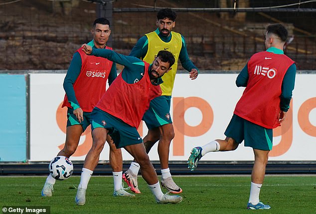 Fernandes (centre) has been preparing for Nations League clashes with Scotland and Poland