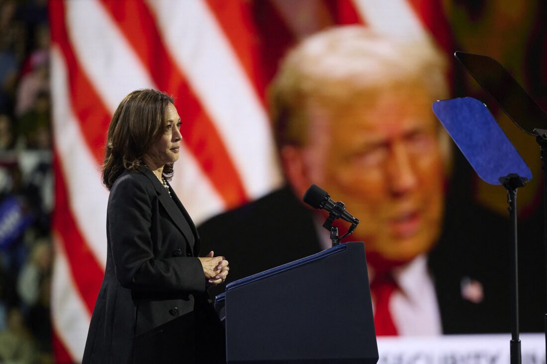 Vice President Kamala Harris plays a highlight reel of her opponent, former President Donald Trump, during a rally in Erie, Pa., on October 14, 2024.