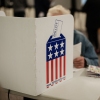 A man votes at a public library turned into an early voting polling station in Black Mountain, N.C., on Oct. 29.