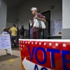 A person leaves an early voting site after casting a ballot on Oct. 21 in Deland, Fla. Florida is one of three states that recently sued the Biden administration over citizenship checks of voters.