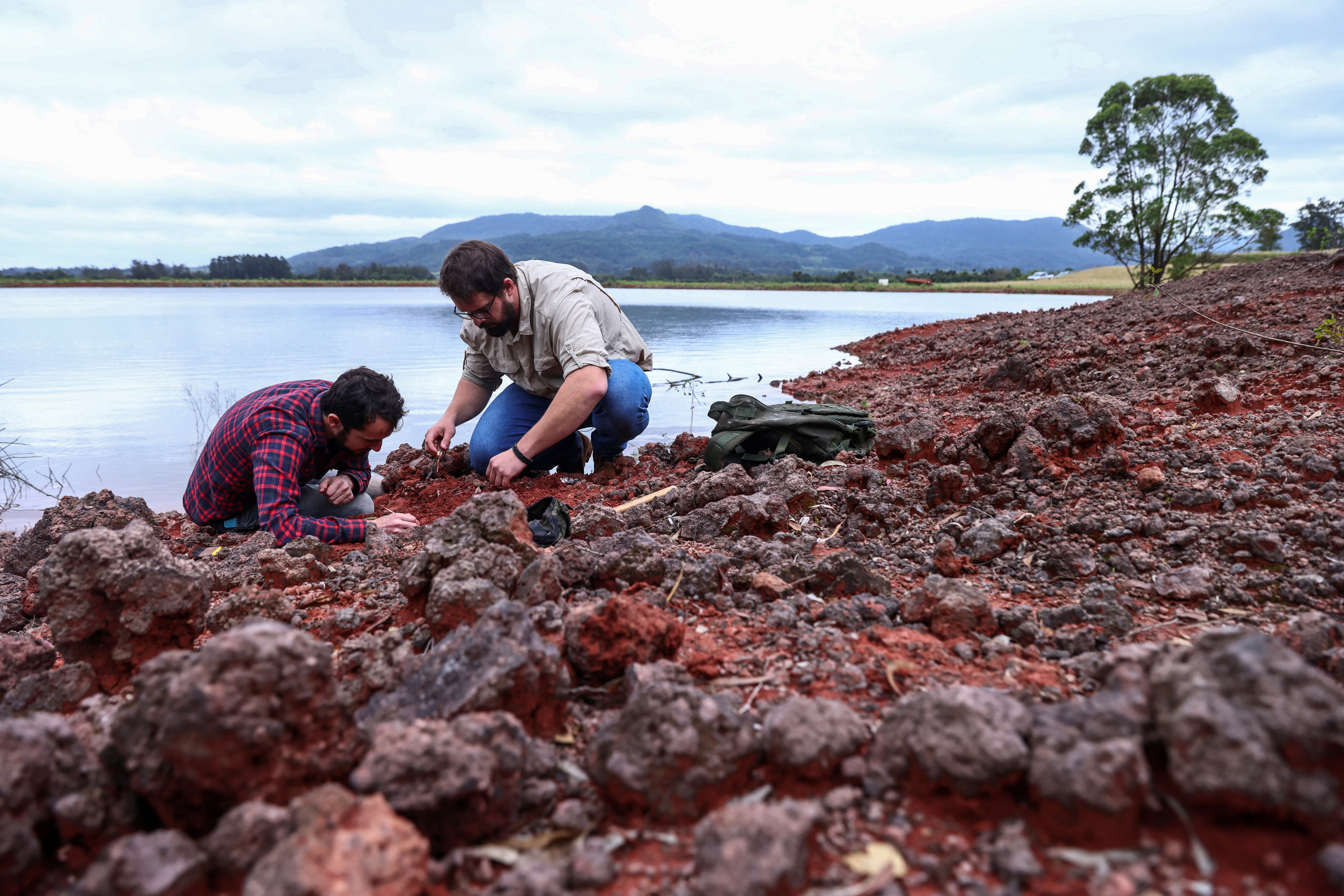 Paleontologist Rodrigo Temp Muller and geologist Jossano de Rosso Morais, both from the Federal University of Santa Maria, search for fossils at the archaeological site, where fossils of the Gondwanax paraisensis, a species that lived 237 million years ago and was a precursor to dinosaurs were discovered, in the city of Paraiso do Sul, Rio Grande do Sul state, Brazil,