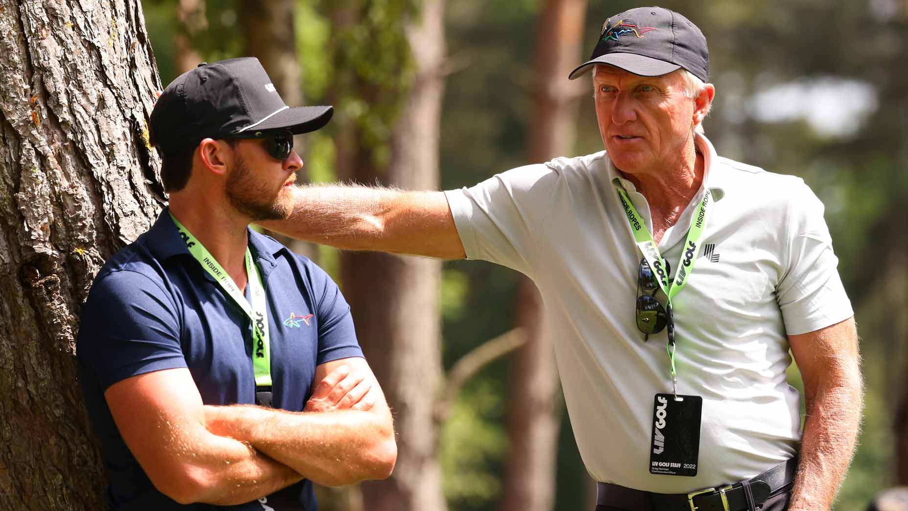 Greg Norman Jr. talks to father Greg Norman during day two of the 2022 LIV Golf Invitational London.