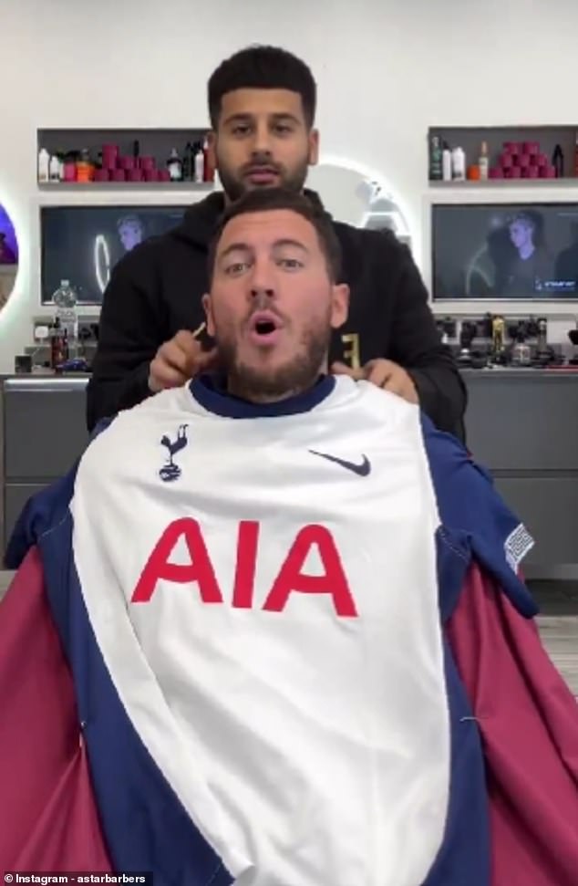 Eden Hazard was unimpressed as Ahmed Alsanawi, the owner of A Star Barbers, draped him in a Tottenham kit