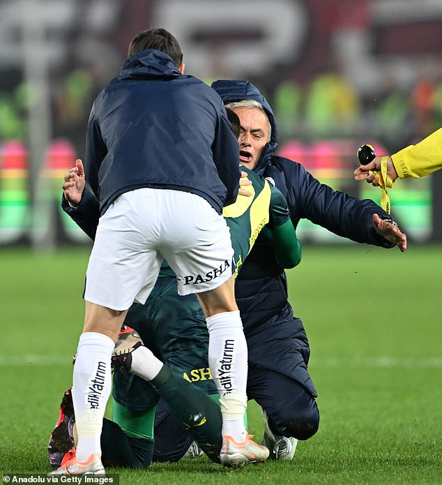 Fenerbahce boss Jose Mourinho stumbled after attempting a knee-slide on Sunday night